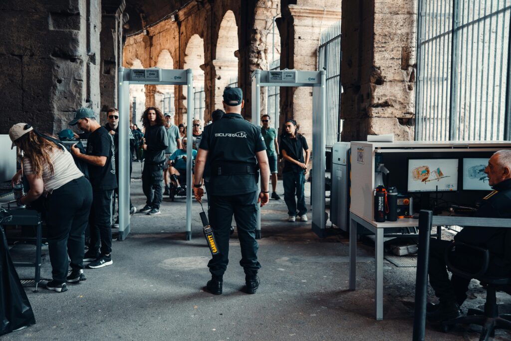 Security checkpoint with guards at a bustling historical site entrance.